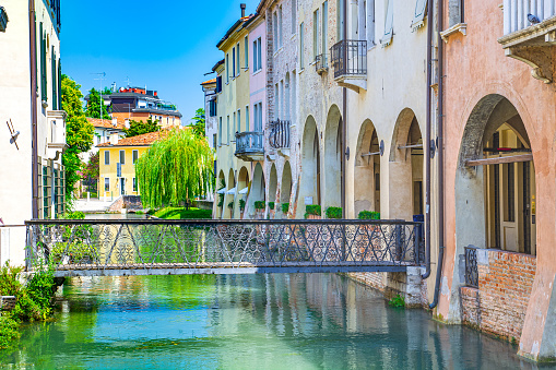 Treviso town in northern Italy, Botteniga river  channel, bridge and old buildings