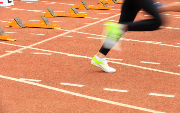 istock sprint start in track and field in blurred motion 1189360915