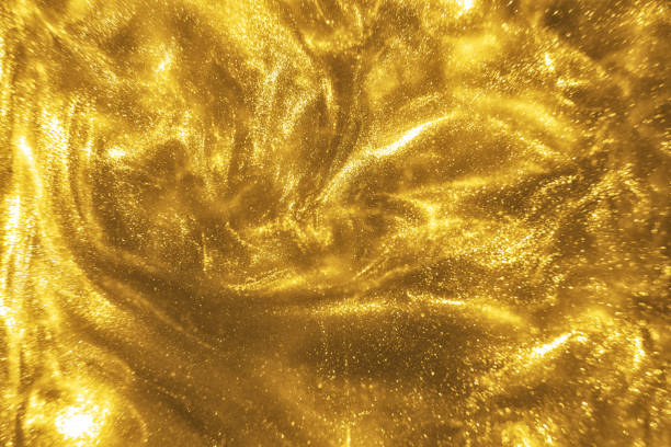 istock gold glitter shimmering magic bokeh background 1189361554