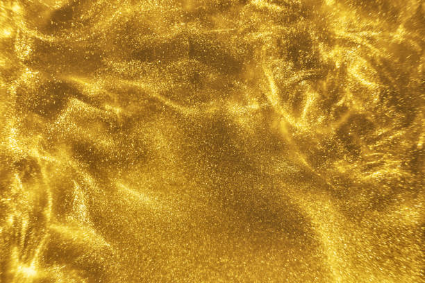 istock gold glitter shimmering magic bokeh background 1189361577
