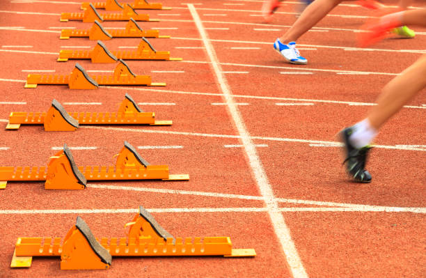 istock sprint start in track and field in blurred motion 1189361585