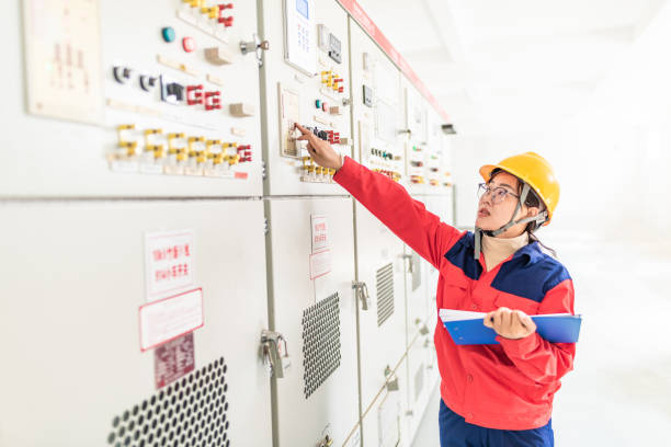 istock Asian female engineer working at the electricity substation 1189361743