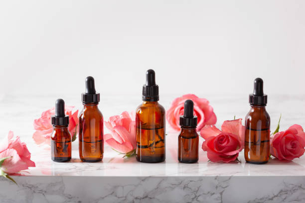istock essential oils in bottles rose flowers. alternative medicine aromatherapy 1189362240