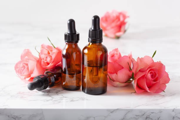 istock essential oils in bottles rose flowers. alternative medicine aromatherapy 1189362420