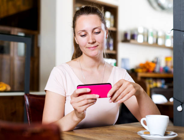 istock Girl ordered coffee and chatting in the phone 1189363084