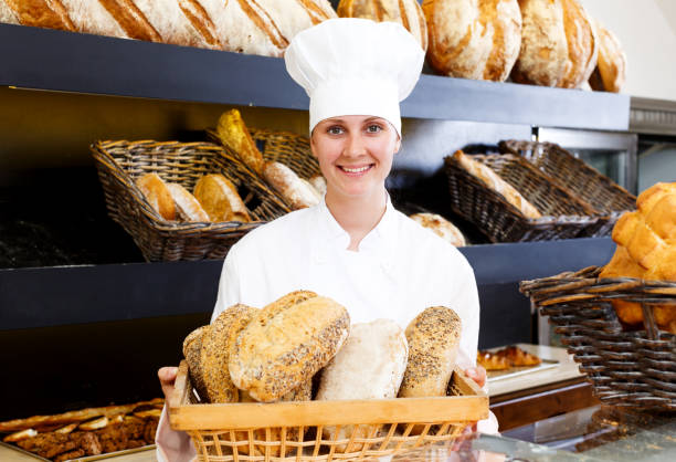istock Bakery female employee with tasty 1189363091