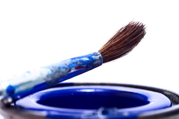 istock Tins of model paint and a fine paint brush 1189363532