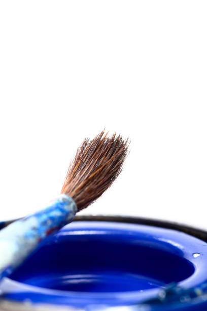istock Tins of model paint and a fine paint brush 1189363595