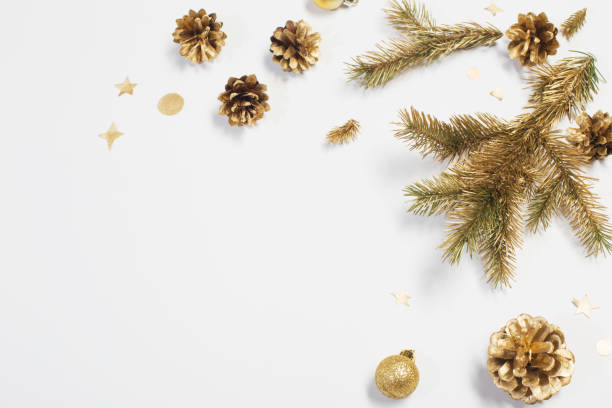 istock golden Christmas decorations on white background 1189364854