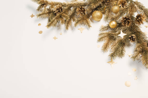 istock golden Christmas decorations on white background 1189364859