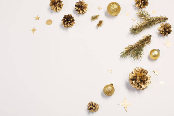 istock golden Christmas decorations on white background 1189364864