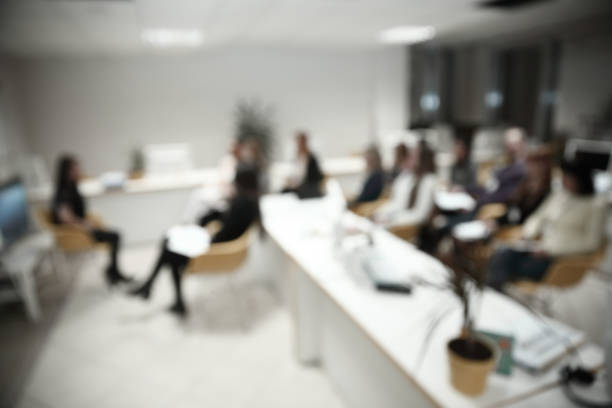 istock blurred image of a large modern office 1189365026