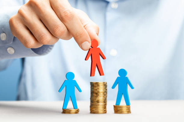 istock Successful businessman on a stack of coins. Big profit 1189365093