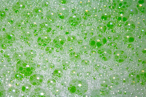 Close Up of Bath Water Bubbles Foam For Background In Green