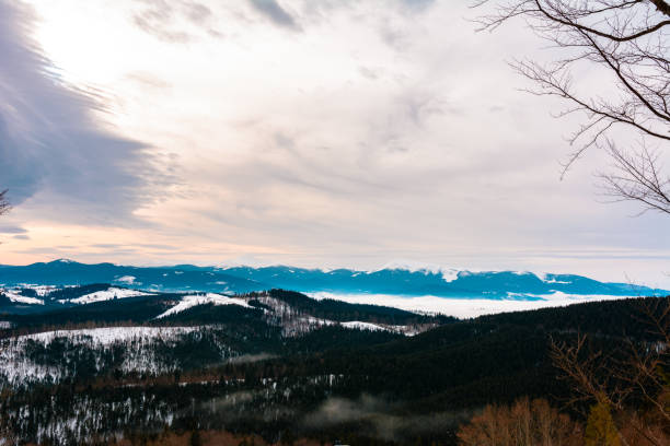 istock Winter tranquil stretched mountain landscape and the Carpathian mountain range behind. 1189365415