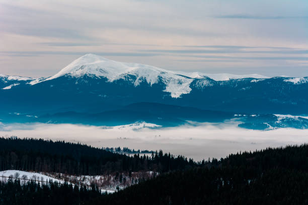 istock Winter tranquil stretched mountain landscape and the Carpathian mountain range behind. 1189365479