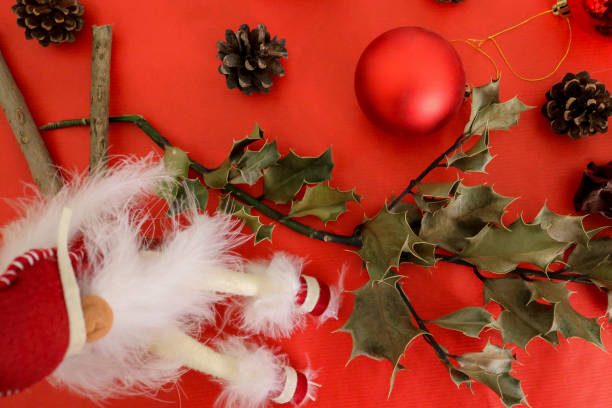 istock Christmas decorations on red background gift card 1189366459