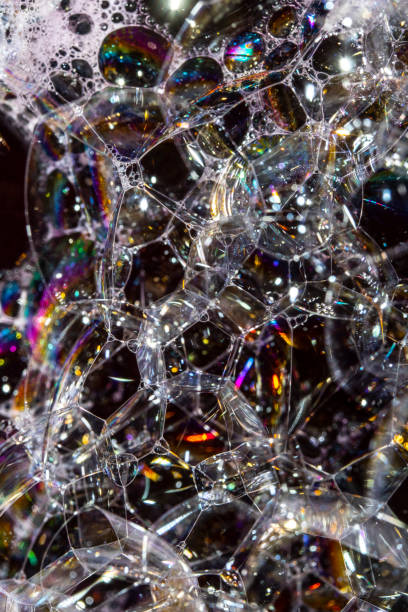 istock Close Up of Bath Water Bubbles Foam For Background In Rainbow Black 1189367953