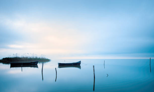 beautiful lake at sunset time and boats