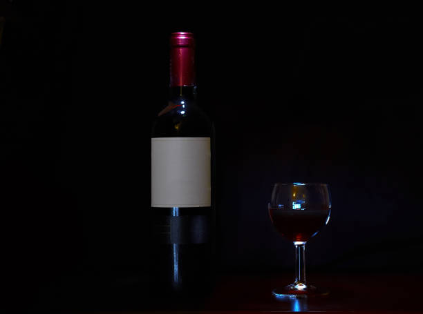 istock Bottle of red wine with glass 1189369309