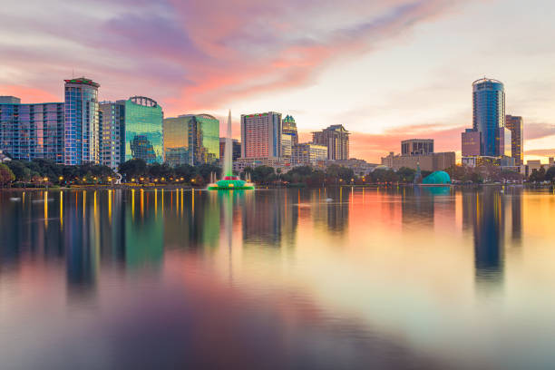 Orlando, Florida, USA downtown city skyline from Eola Park Orlando, Florida, USA downtown city skyline from Eola Park at dusk. orlando florida stock pictures, royalty-free photos & images