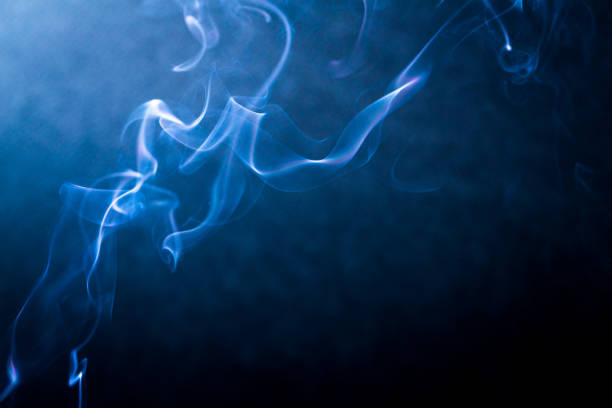 istock Swirling smoke abstract close up on black background 1189369612