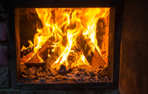 istock fire in the chimney in winter time 1189369728