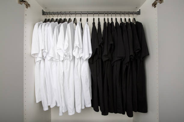 istock black and white shirts on hangers in a row 1189369827