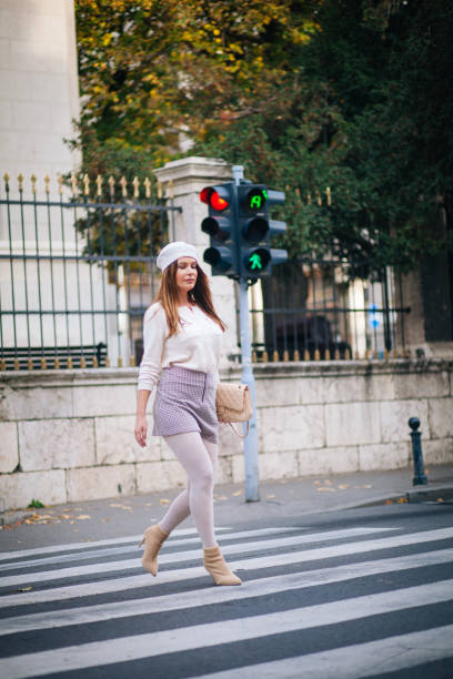 istock Pretty woman walking down the streets 1189371341