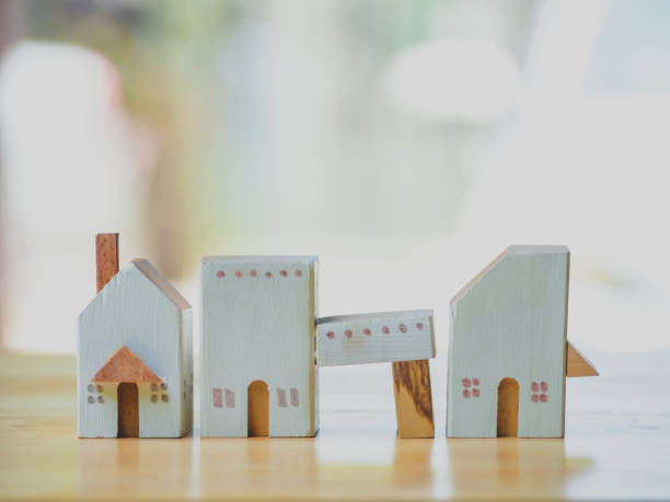 istock Closeup miniature house on wooden table with copy space concept. 1189373415