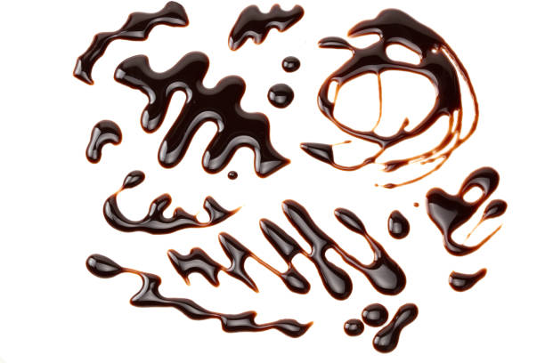 istock chocolate sauce isolated on white background. chocolate wave 1189374195