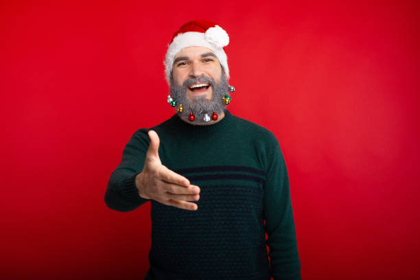 istock Portrait of cheerful man with decorated beard shaking hands 1189378449