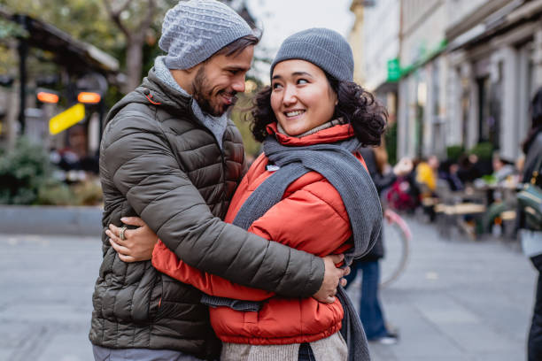 istock Young couple embracing outside on a winter day 1189380219