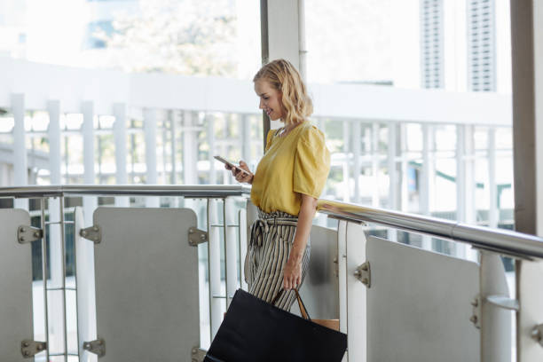 istock Elegant Woman Using Her Cell Phone 1189380290