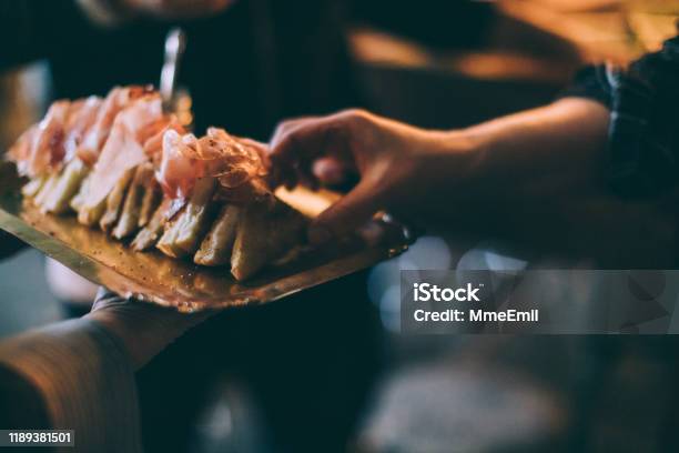 Eating Grilled Cheese Sandwich During A Party Stock Photo - Download Image Now - Food And Drink Industry, Food Service Occupation, Buffet