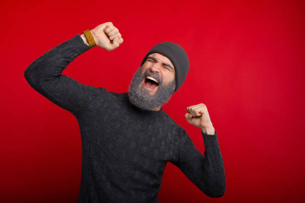 istock Handsome young man with white beard celebrate victory, New Year Eve Is Here 1189381656