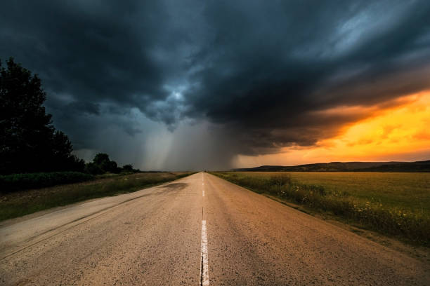 istock Epic Thunderstorm over a asphalt road. Road to the storm 1189384355