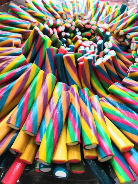 Sour jelly strips in candy shop. Colorful chewing marmalade for background