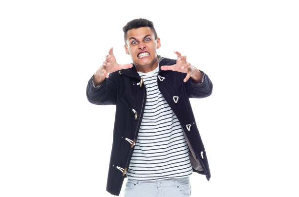 One person / front view / waist up of 20-29 years old adult handsome people / tall person african ethnicity / african-american ethnicity male / young men standing wearing jacket / warm clothing who is angry / disappointed / frustration / displeased una persona / vista frontal / cintura para arriba de 20-29 años de edad adulto guapo personas / persona alta etnia africana / etnia afroamericana hombre / hombres jóvenes de pie con chaqueta / ropa caliente que está enojado / decepcionado / frustración