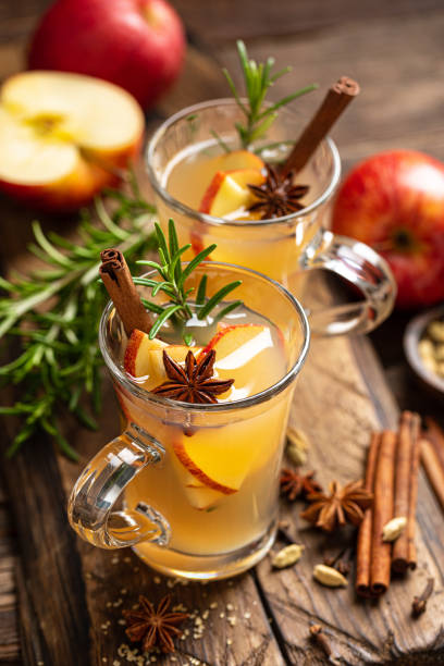 istock Christmas mulled apple cider with cinnamon and anise, traditional winter warming hot drink, beverage or cocktail 1189386399