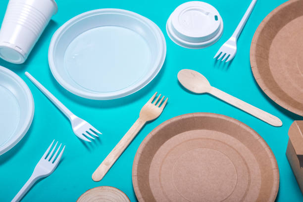 istock Flat lay composition disposable plastic tableware and eco friendly paper bamboo dishes. plastic processing problem. 1189388019