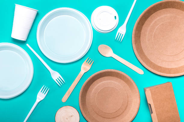 istock Flat lay composition disposable plastic tableware and eco friendly paper bamboo dishes. plastic processing problem. 1189388040
