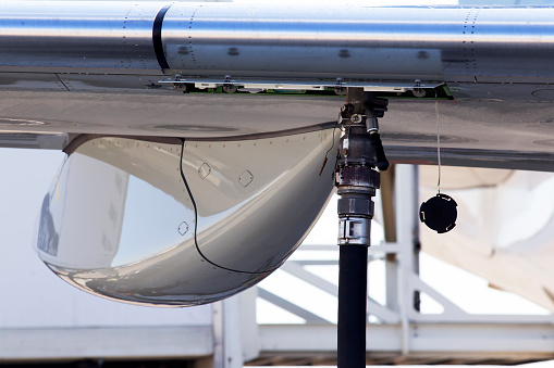 Refueling aircraft process at the airport, close-up
