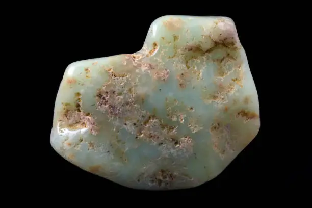 Chrysoprase (chrysoprasus) mineral from Australia isolated on a pure black background