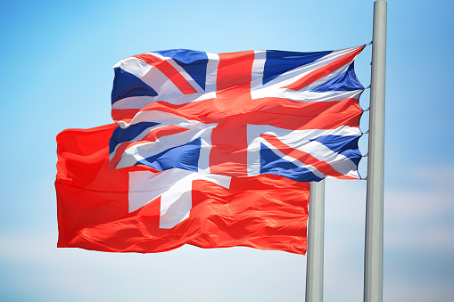 The Royal Courts of Justice blended with a UK Union flag.