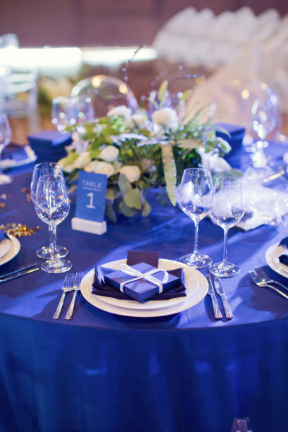 istock Beautiful table setting with white and green flowers. Space theme wedding decorations 1189392601