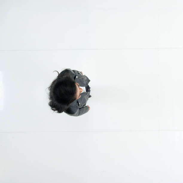One person / full length / directly above view / aerial view of 20-29 years old adult beautiful black hair / long hair latin american and hispanic ethnicity female / young women standing in front of white background wearing leather jacket / cool attitude una persona / longitud completa / directamente por encima de la vista / vista aérea de 20-29 años de edad adulto hermoso pelo negro / pelo largo latinoamericano y etnia hispana mujer / mujeres jóvenes de pie frente al fondo blanco usando chaqueta de cue