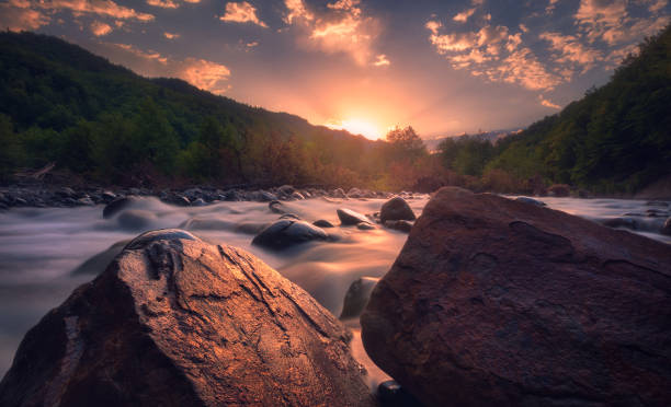 istock sunrise over beautiful mountain river 1189394594