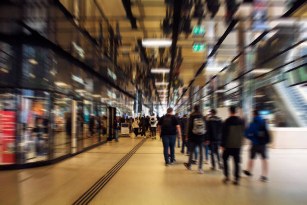 istock Blurry motion image of people walking at the main train station called Amsterdam Centraal. A major international railway hub, it is used by 162,000 passengers a day. Transportation concept. 1189395029