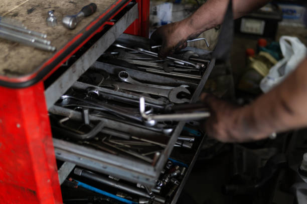 istock Close-up image of car service worker, taking tools from box for mechanical instruments. 1189396790